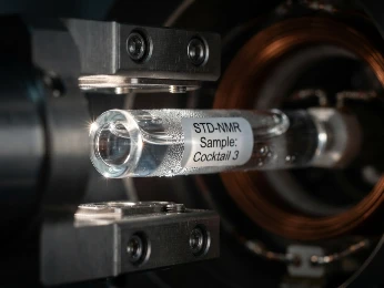 Close-up of a SampleJet automated sample changer rack with NMR tubes containing fragment cocktails, ready for high-throughput screening.